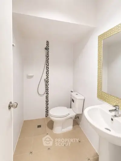 Modern minimalist bathroom with sleek fixtures and elegant tile design.