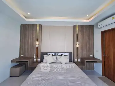 Modern bedroom with stylish wood accents and ambient lighting