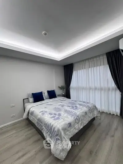 Modern bedroom with stylish decor and natural light