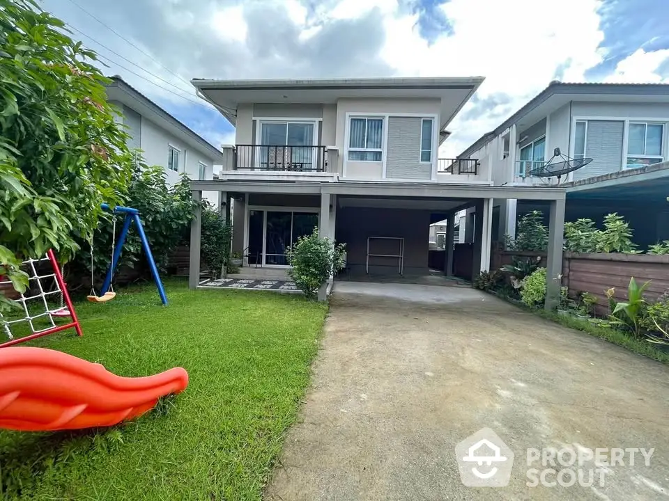 Charming two-story house with lush garden and spacious driveway in a serene neighborhood.