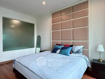 Luxurious bedroom with elegant padded headboard and stylish decor