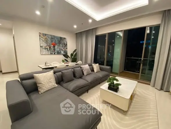 Luxurious modern living room with elegant decor and spacious seating area.