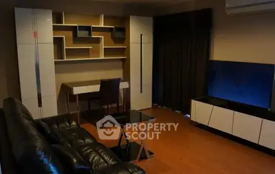 Modern living room with sleek furniture and stylish shelving unit