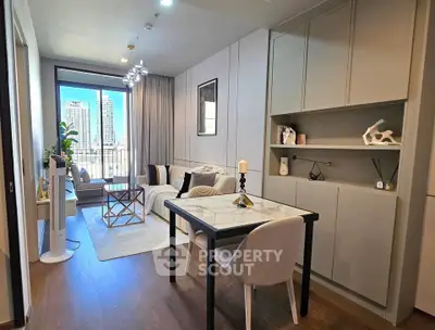 Modern living room with elegant decor and city view, featuring stylish furniture and ample natural light.