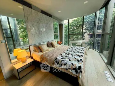 Luxurious bedroom with floor-to-ceiling windows and modern decor in a high-rise apartment.