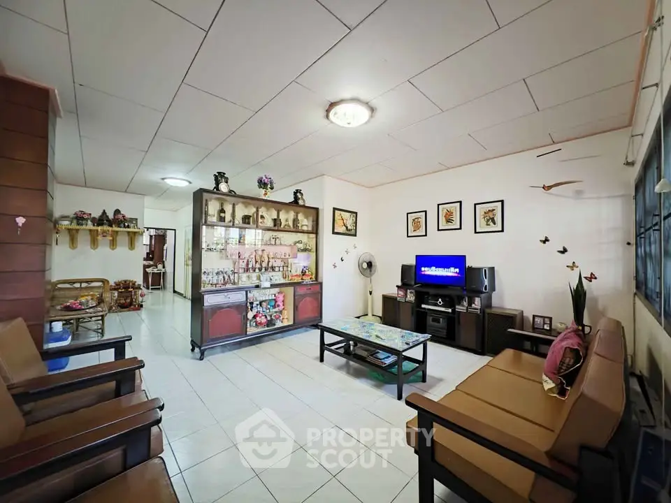 Spacious living room with stylish decor and ample seating in a cozy home.