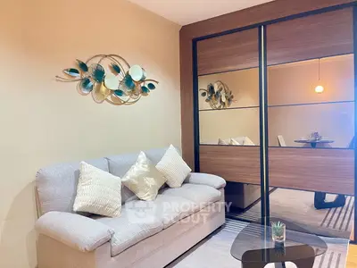 Cozy living room with stylish decor and mirrored wardrobe