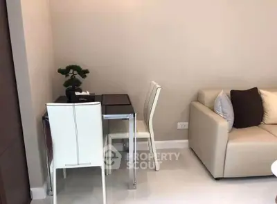 Modern living room with sleek dining area and stylish sofa