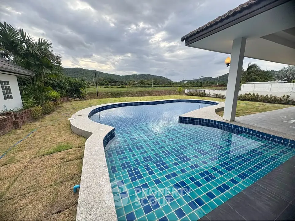 Stunning private pool with scenic mountain views in a luxurious property setting.