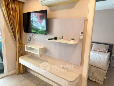 Modern living room with wall-mounted TV and stylish decor