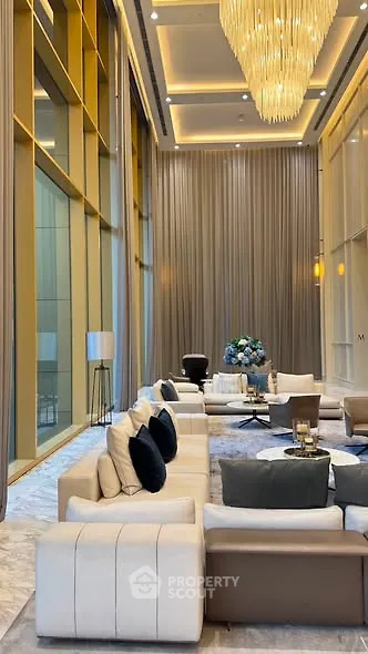 Luxurious high-ceiling living room with elegant decor and modern furniture in a sophisticated setting.