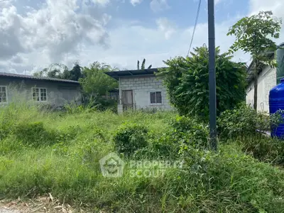 Charming rural property with lush greenery and rustic exterior, perfect for nature lovers seeking tranquility.