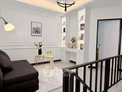 Elegant living room with modern decor and cozy seating area, perfect for relaxation and entertaining.