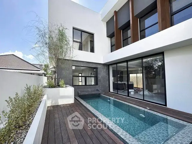 Modern luxury home with sleek pool and stylish exterior design