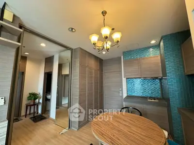 Modern kitchen with wooden cabinets and stylish chandelier