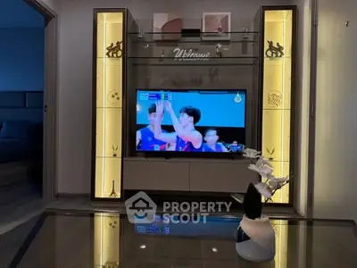 Modern living room with stylish TV unit and ambient lighting