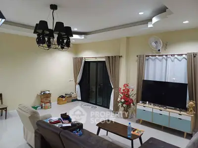 Spacious living room with modern decor and large windows for natural light.
