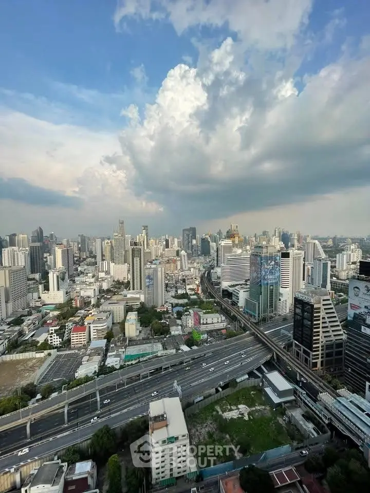 Stunning cityscape view with skyscrapers and highway, showcasing urban living at its finest.