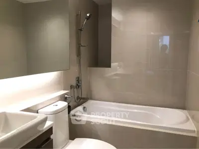 Modern bathroom with sleek design and bathtub in contemporary apartment