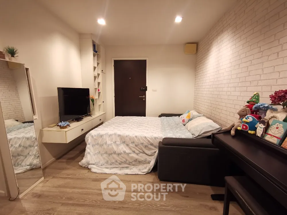 Cozy bedroom with modern decor and stylish furniture in a contemporary apartment.