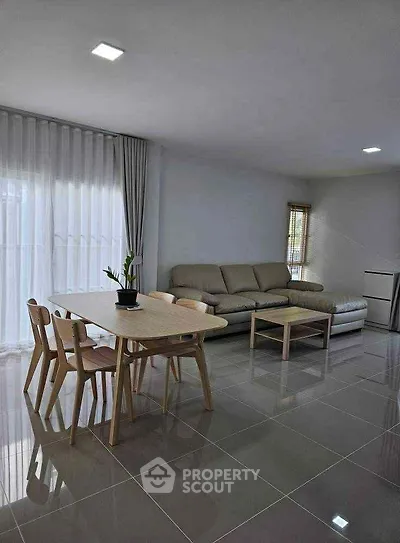 Spacious modern living room with sleek furniture and natural light