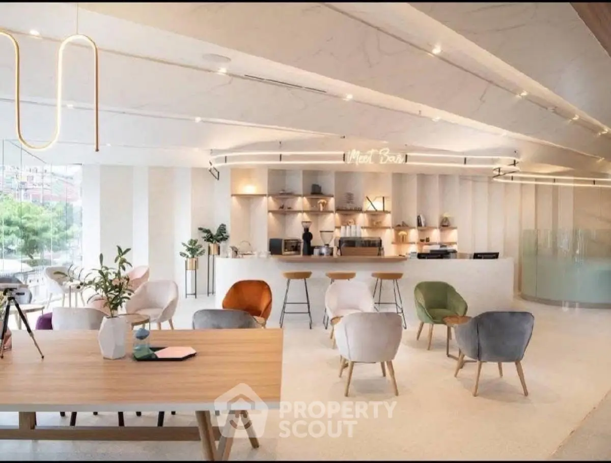 Modern open-plan living area with stylish furniture and contemporary design.