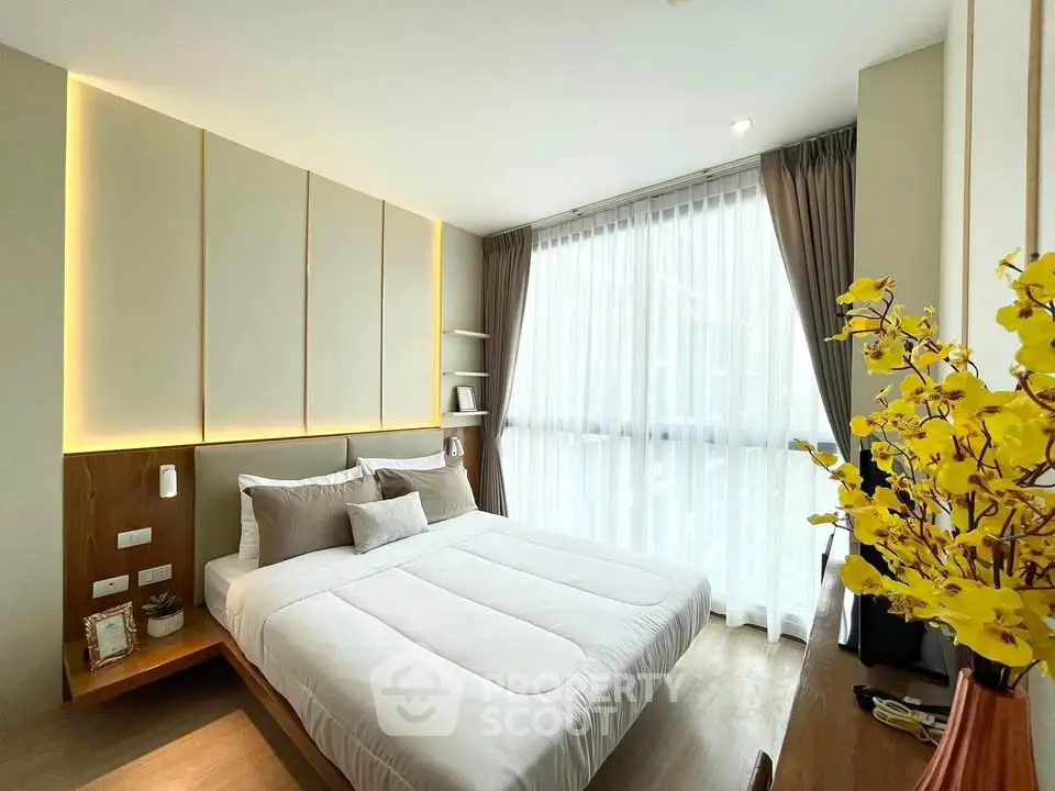 Modern bedroom with large window and stylish decor