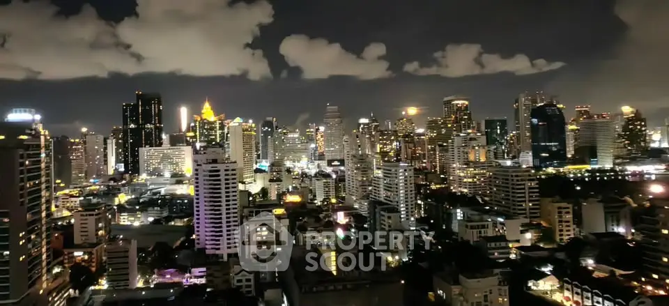 Stunning nighttime cityscape view showcasing a vibrant skyline with illuminated skyscrapers.
