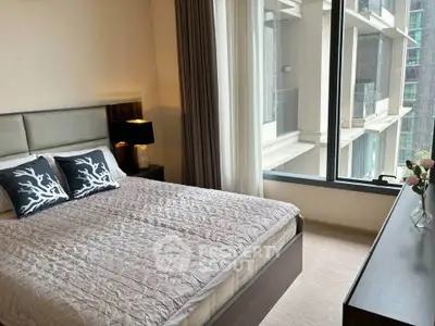 Modern bedroom with large window and stylish decor in urban apartment