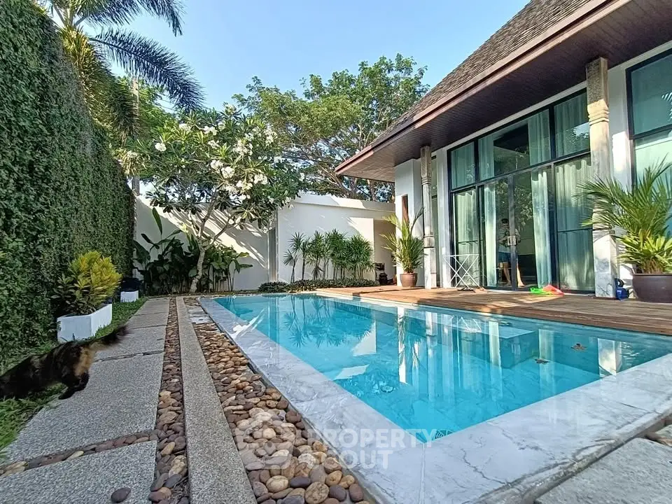 Luxurious villa with private pool and lush garden, perfect for relaxation and entertainment.
