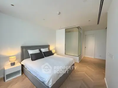 Luxurious bedroom with modern design and elegant lighting in a high-end apartment.