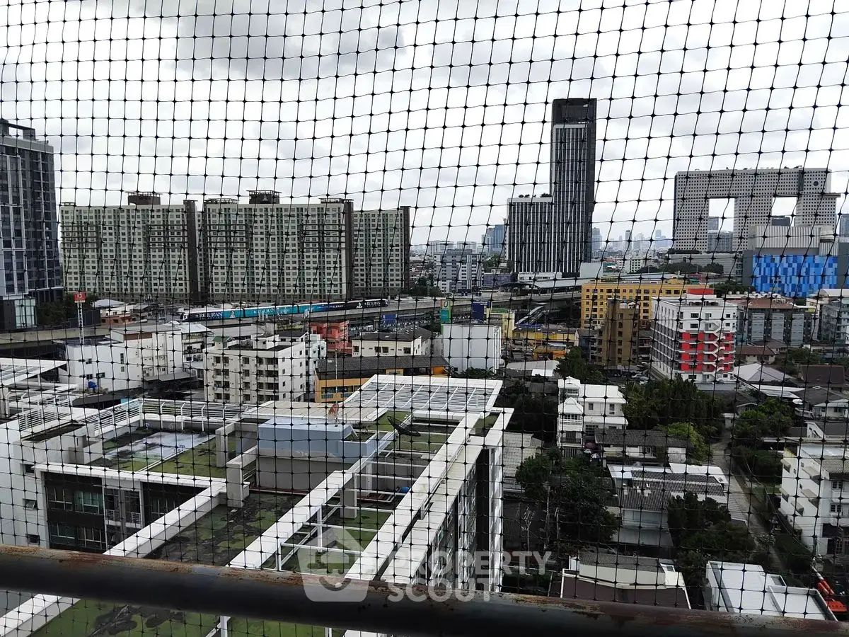 Stunning cityscape view from high-rise balcony with urban skyline and modern architecture.