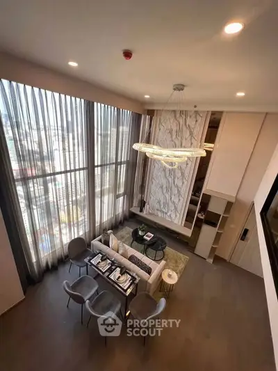 Luxurious high-ceiling living room with panoramic city views and elegant dining area.