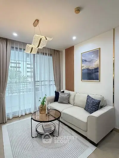 Modern living room with elegant decor and large window view