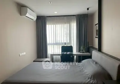 Modern bedroom with sleek design, featuring a comfortable bed, desk, and large window with curtains.