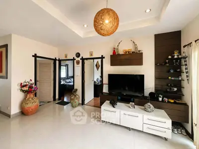 Spacious living room with modern decor and entertainment center