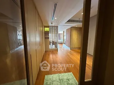 Spacious modern living room with wooden flooring and stylish decor