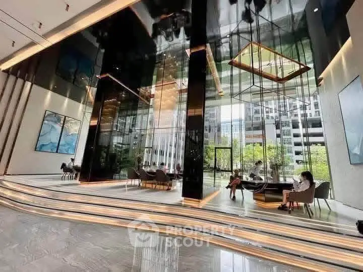 Luxurious modern building lobby with high ceilings and elegant seating area.
