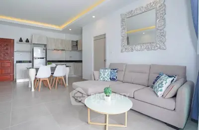 Modern living room with stylish decor and open kitchen layout