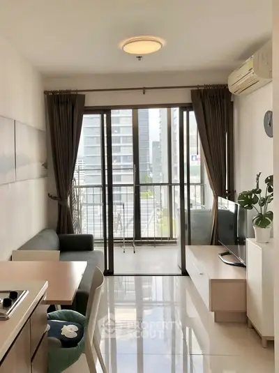 Modern living room with balcony view in high-rise apartment