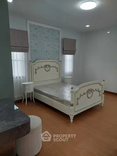 Elegant bedroom with classic bed frame and stylish decor