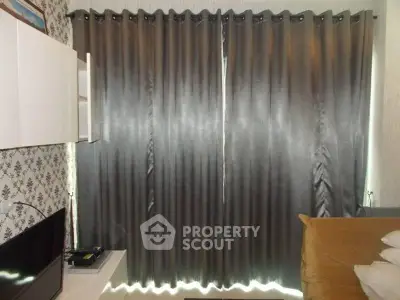 Cozy living room with modern curtains and wall-mounted TV