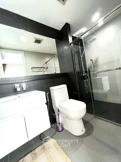 Modern bathroom with sleek design and glass shower enclosure