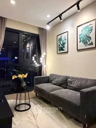 Stylish modern living room with cozy gray sofa and elegant decor