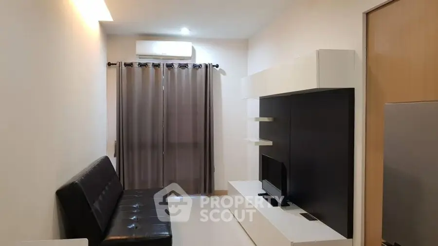 Modern living room with sleek furniture and neutral tones