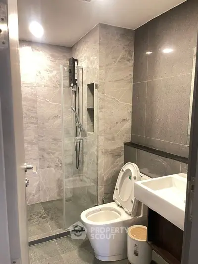 Modern bathroom with sleek design and glass shower enclosure