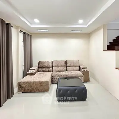 Spacious living room with plush sofa and modern decor