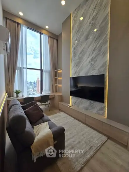Luxurious high-ceiling living room with modern decor and stunning city view.