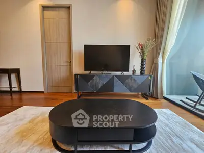 Modern living room with stylish furniture and large window view