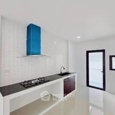 Modern kitchen with sleek gas stove and minimalist design